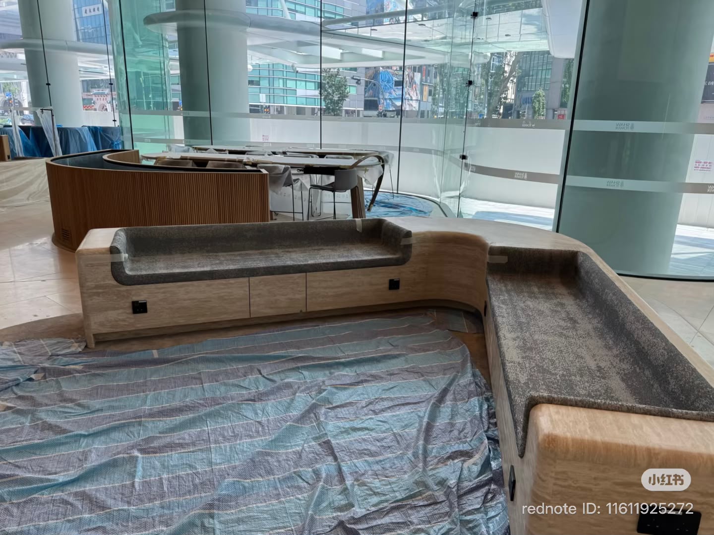 Fitted grey upholstered seats and backs within the Shaw Tower lobby seating structure