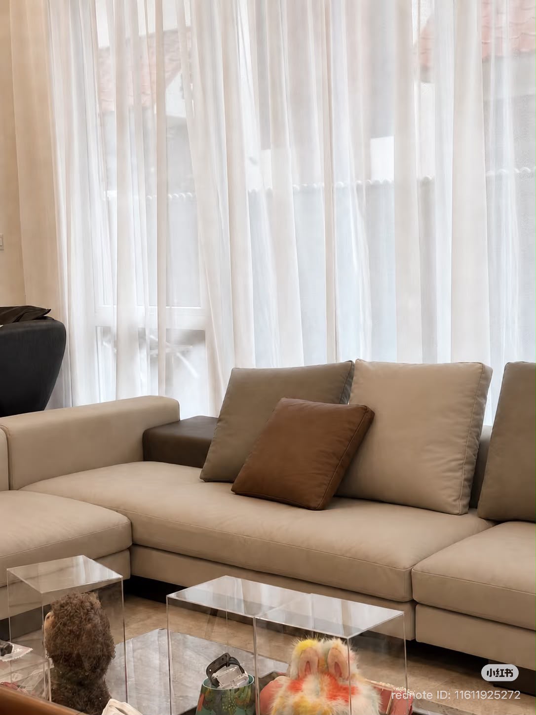 Completed light-coloured leather seat and back cushions with brown accent cushion